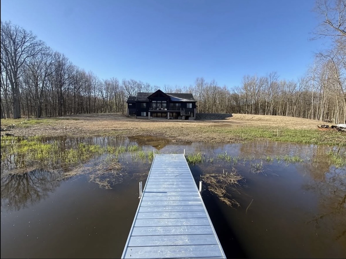 Cleared and graded lakefront lot with dock