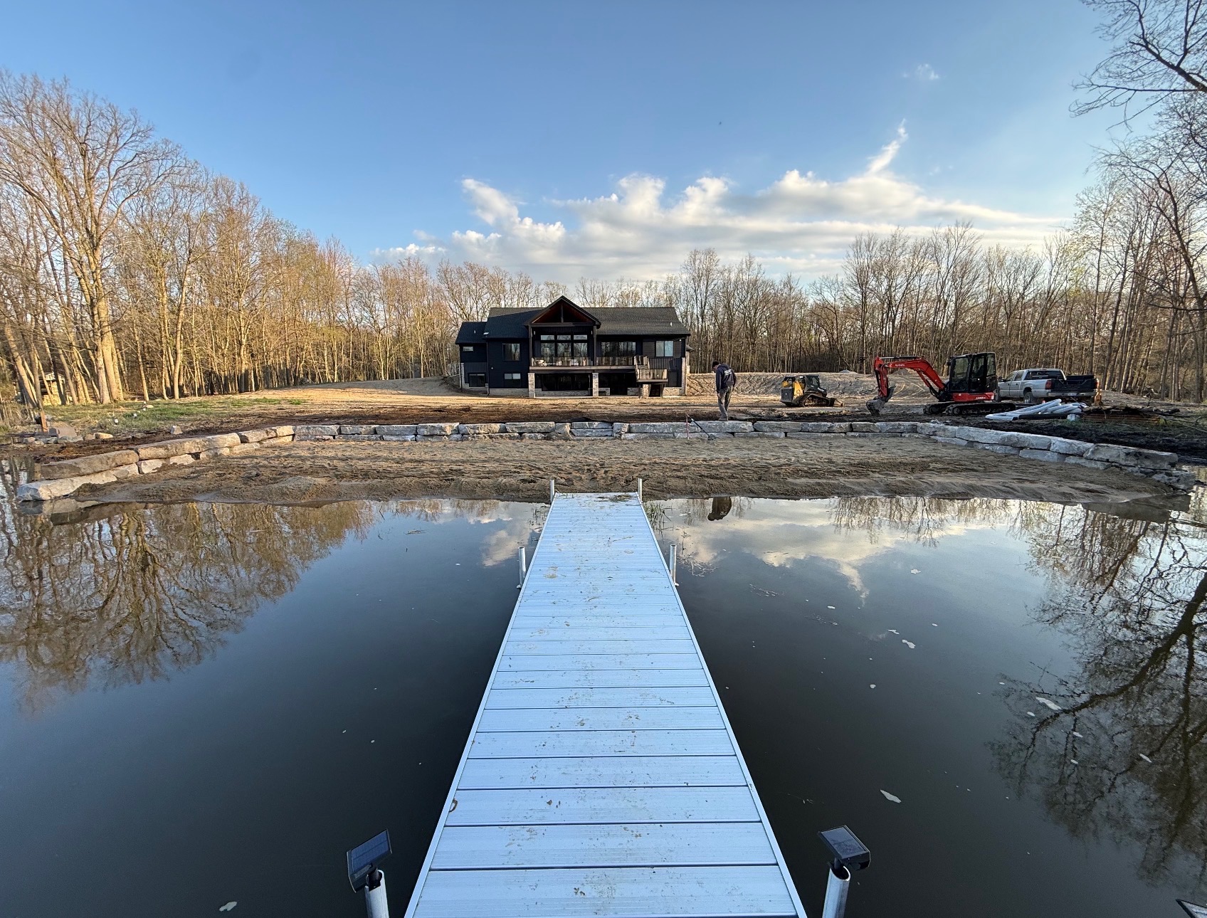 Great Lakes Landworx completed lakefront project with dock, retaining wall, and site work