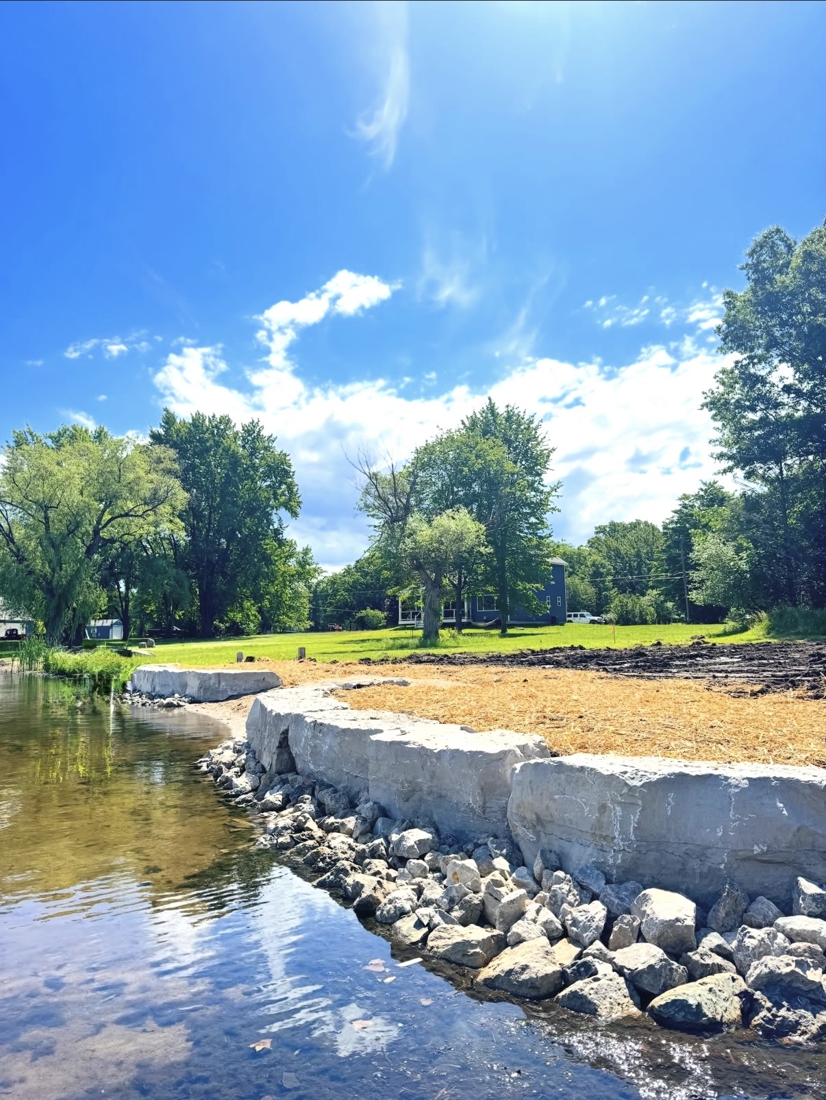 New seawall with fresh sand fill along the shoreline